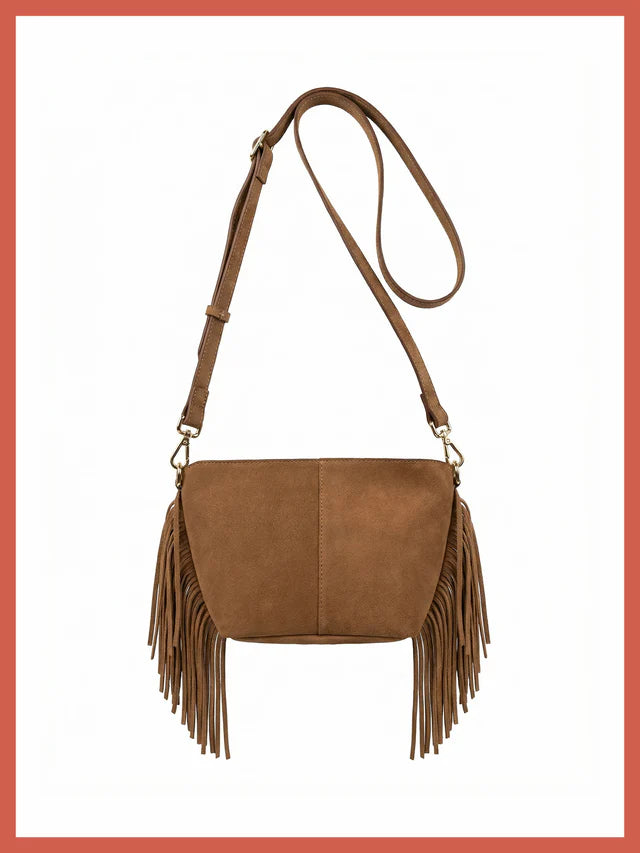 The Kingston Tassle Cross Body Bag from NOOKI is back for Spring Summer in a perfect neutral shade,&nbsp; offering easy casual, bohemian style with a supersoft suede leather and detailed fringe.