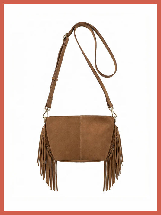 The Kingston Tassle Cross Body Bag from NOOKI is back for Spring Summer in a perfect neutral shade,&nbsp; offering easy casual, bohemian style with a supersoft suede leather and detailed fringe.
