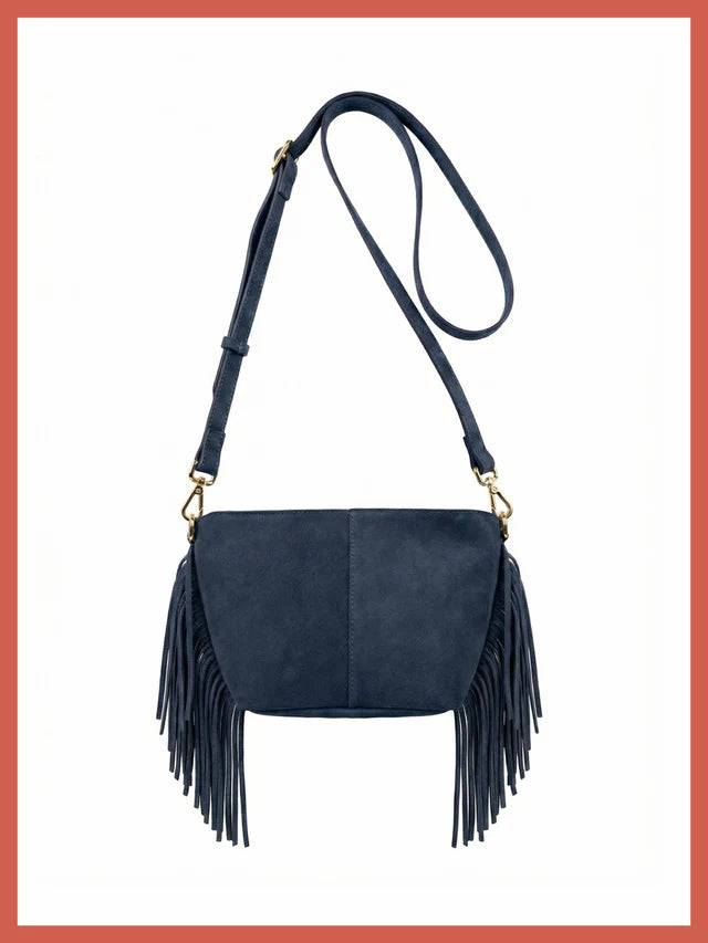 The Kingston Tassle Cross Body Bag from NOOKI is back for Spring Summer in a perfect neutral shade,&nbsp; offering easy casual, bohemian style with a supersoft suede leather and detailed fringe.