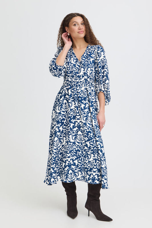 Midi dress with a defined waist, V-neckline from Scadi brand FRANSA, softly textured finish and voluminous long sleeves. Flared skirt and gathered seam detailing create a fluid silhouette.