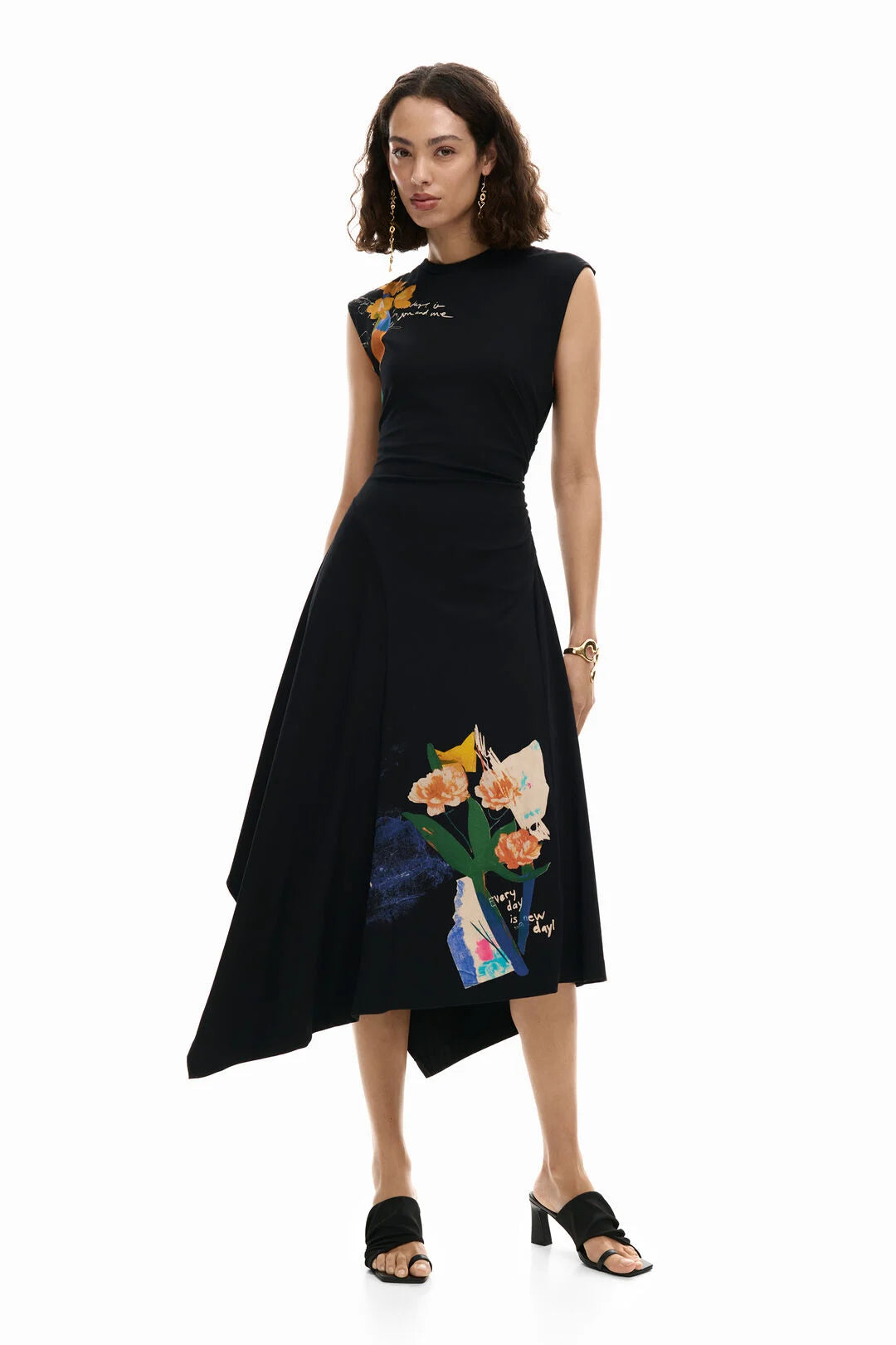 Sleeveless dress with an asymmetrical cut, draping on the side, and positional floral print on the side and hem. Designed in Barcelona by DESIGUAL.