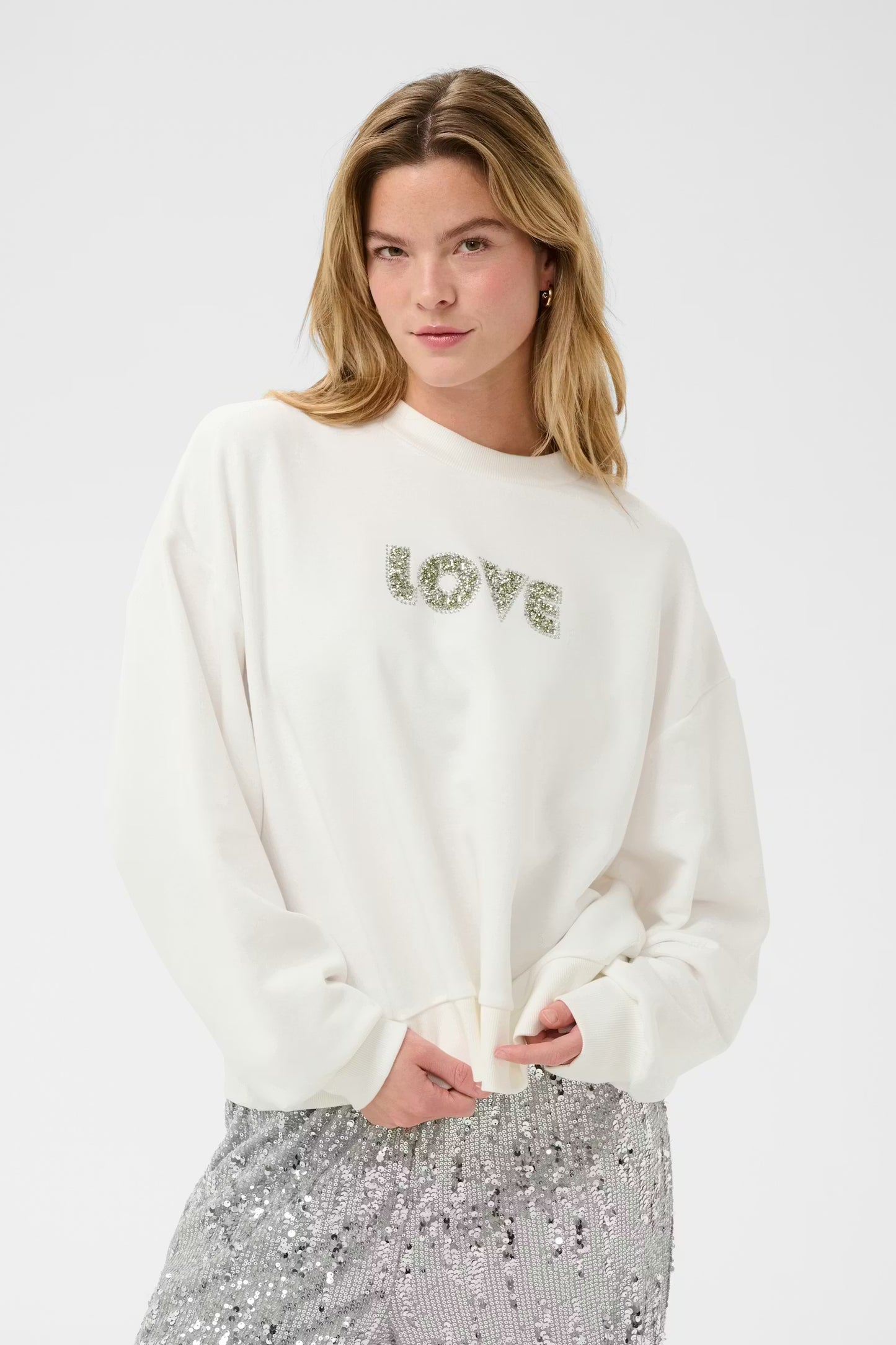 This sweatshirt from KAFFE features a relaxed, boxy silhouette with a crew neckline and dropped shoulders. Ribbed cuffs and hem add definition, while the soft-finished fabric ensures effortless style and comfort in one standout staple. It is very very oversized.