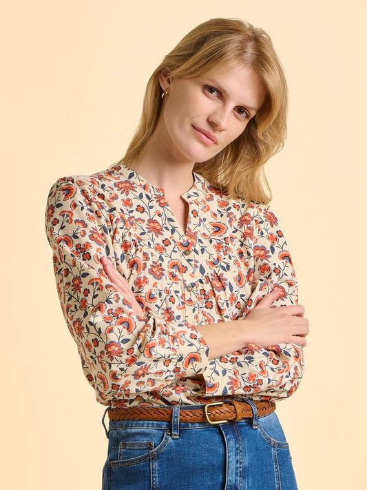 A great needlecord blouse from BRAKEBURN in a neutral cream background with orange and navy floral print. A V neck blouse with slightly gathered yoke and button front. Long sleeves with simple button cuff. Gorgeous worn with denim. Fits true to size.