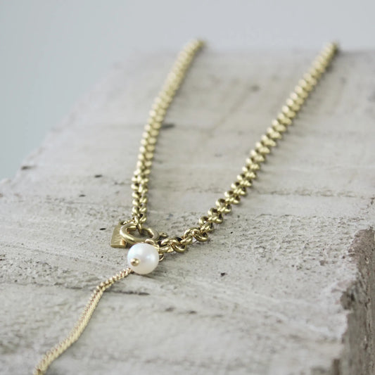 Adorn yourself with the elegance of the Joy Waterproof Link Pearl Necklace. Crafted with freshwater pearls and 18K gold plating, this necklace exudes sophistication and luxury. Perfect for any occasion, it will add a touch of elegance and glamour to your outfit. Stay stylish while embracing the beauty of nature.