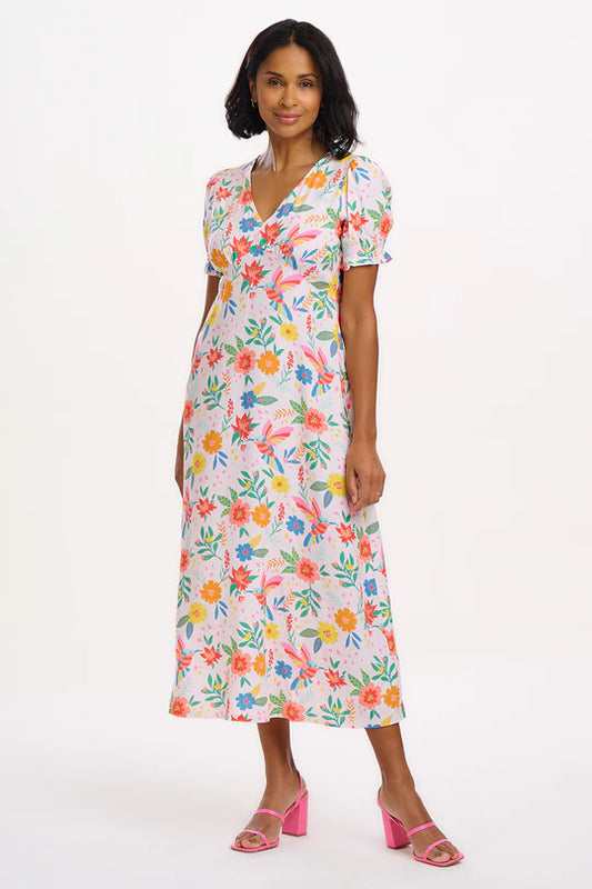 The Maryjane dress showcases a timeless V-neck tea silhouette, complete with an empire bust line and charming short-shirred cuffs. It's adorned with our vibrant new Tropical Hummingbird print, featuring a delightful array of colourful flowers and hummingbirds set against a soft off-white background.

Margarita is 5'9" and is wearing a size 10
100% LENZING™ ECOVERO™ Viscose
Machine Washable (Delicate)
V-neck
Tea dress shape
Short sleeves with shirred cuffs
Empire bust line
Neck to hem length for a size 12: 1