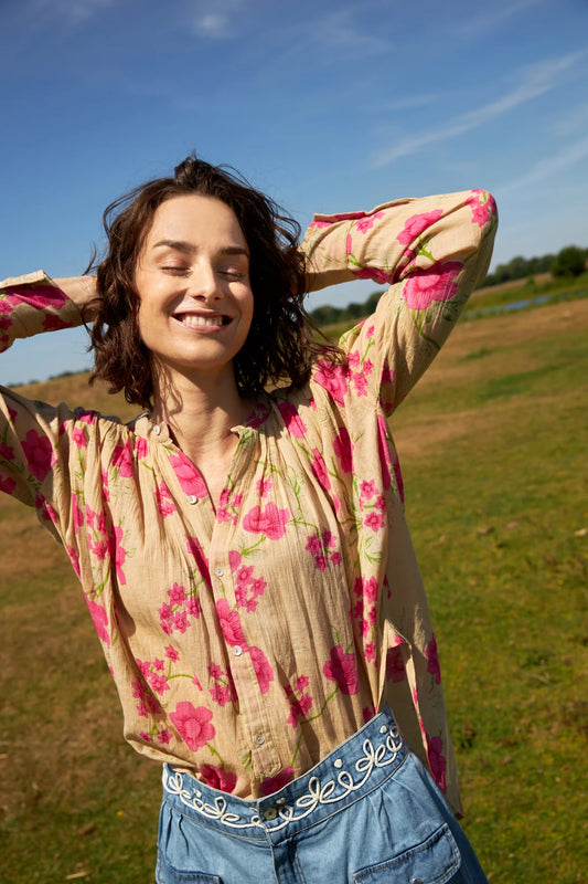 A beautiful piece from French brand CHICO SOLEIL in a stunning bright floral print. A bohemian style piece in the softest of cotton. With a mandarin style collar with floral buttons to fasten . Slight gathering at the neckline adds a whimsical feel. Long sleeves with two buttons on the cuff to fasten. The fit is true to size.