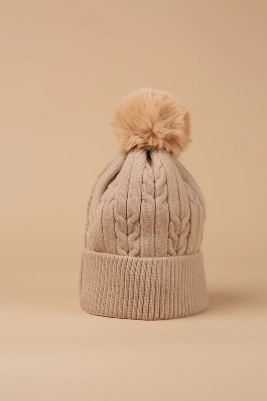 Our ultra-cosy fleece-lined bobble hats feature a chunky knit design and are topped with a fluffy pom-pom. These hats are the perfect winter essential. Warm, soft, and snug, these hats are ideal for cold-weather layering. Available in other colours to suit every wardrobe.