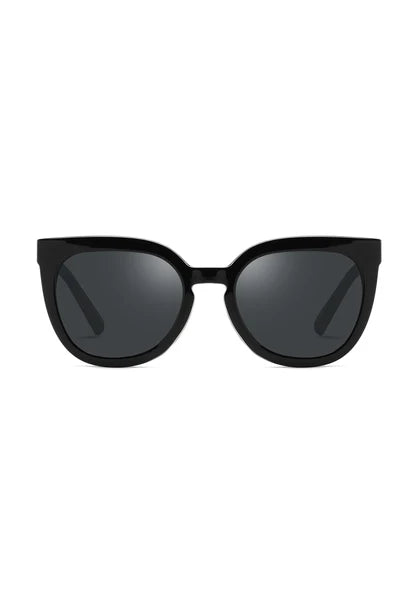 The Mora Black sunglasses from ECO SHADES are the epitome of chic minimalism with their jet-black frame and deep-tinted lenses. This classic black design is both bold and versatile, perfect for any occasion. True to their name, "Mora" evokes the natural beauty of a brunette, embodying elegance and mystery.