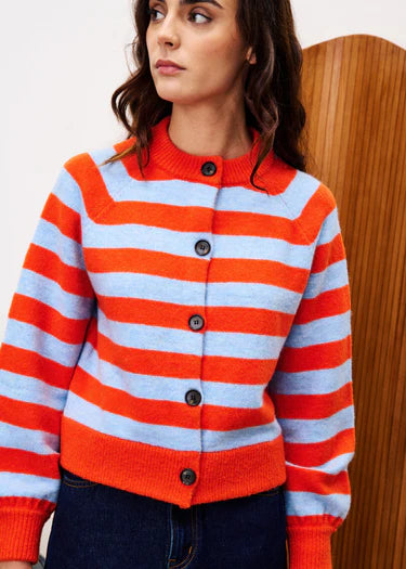 A beautiful horizontal stripe knit from Parisian brand FRNCH. This super warm wool mix is perfect for the cooler months. The combination of red and pale blue is so stunning to the eye. With a contrast button front it looks super stylish as well as being really warm. The fit is true to size.