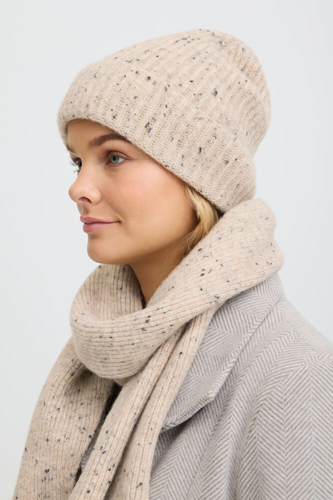 Ribbed beanie from FRANSA with soft texture features a subtle speckled design and a wide turn-up cuff. Close, slightly fitted silhouette for a modern, clean look.