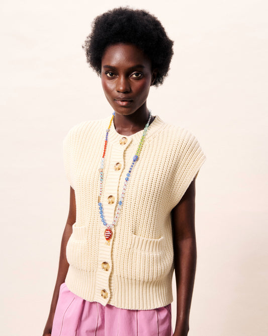 A great sleeveless knit vest with central button fastening and patch pockets from Parisian brand FRNCH. This cool knit is perfect for now and layers easily over a T shirt or shirt. The fit is true to size.