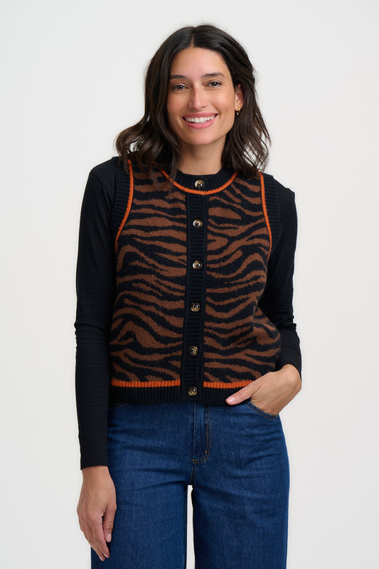 Add a wild touch to your layering with the Natalie Knitted Waistcoat from SUGARHILL, crafted in a warm tan knit with bold natural leopard spots. This sleeveless cardigan features a classic button-front fastening, a ribbed trim, and playful orange tipping for a modern twist. A raw and powerful animal print with a tactile, brushed quality.&nbsp;