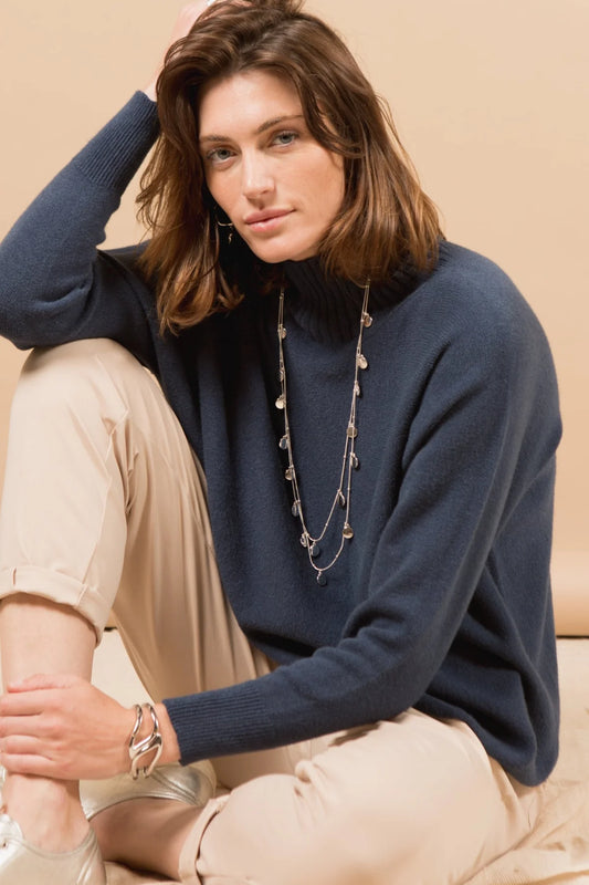 This high neck jumper is a must-have winter staple, crafted in a soft and breathable viscose mix for all-day comfort. The clean silhouette and flattering fit make it an easy addition to any cold-weather collection. Available in different colours, it’s ideal for layering or wearing as a statement piece.