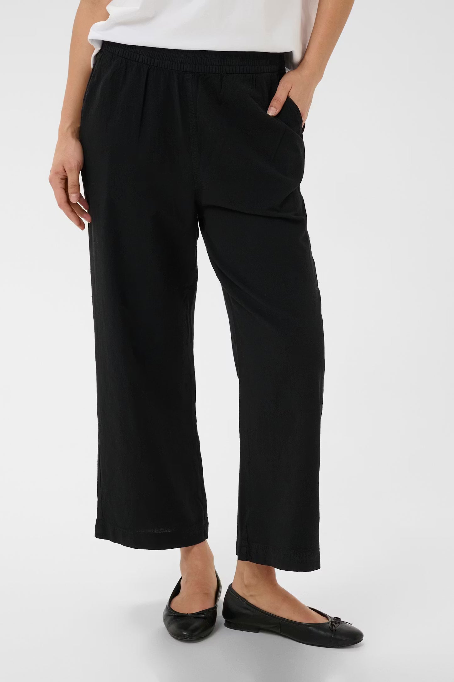 Soft cotton culotte trousers from Scandi brand KAFFE with a wide-leg silhouette and gathered waistband for all-day comfort. Designed with concealed side pockets for a clean and refined look. Fit is true to size.