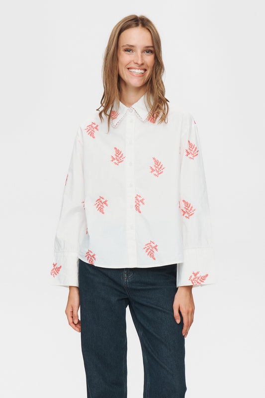 Smart yet relaxed, this shirt from NUMPH blends crisp cotton with fern embroidery. Its regular fit promises comfort on busy days, while the button neck and long sleeves add just enough structure for wherever your plans take you. The fit is true to size.