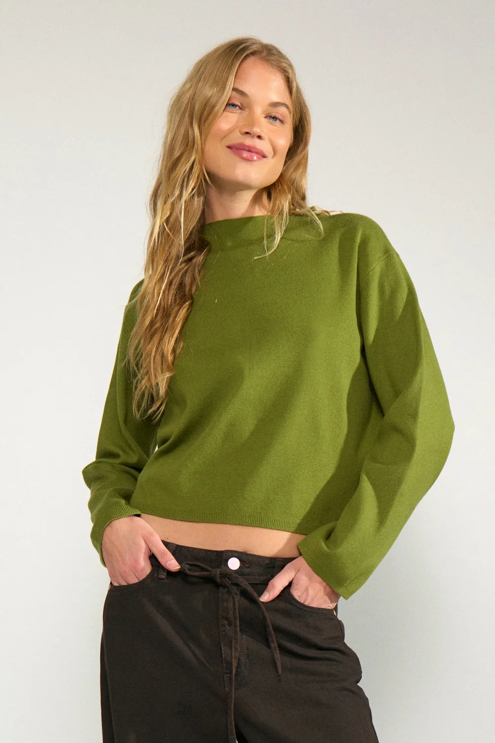 Soft, cropped and quietly luxe, the Nümph NuCarma is the pullover you'll reach for on repeat, from slow Sunday coffees to after-work drinks. This slash neck soft knit is a cropped shape with long sleeves and wider cuff.