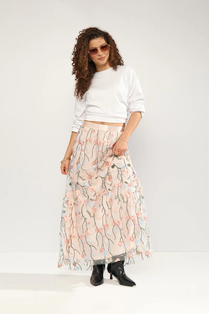 Delicate floral embroidery enhances this flowing maxi skirt from NUMPH. The lightweight material and comfortable fit make it ideal for warm weather occasions. Pair it with a simple top to let the skirt's intricate details shine. The fit is true to size.