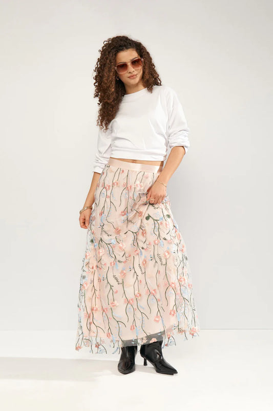 Delicate floral embroidery enhances this flowing maxi skirt from NUMPH. The lightweight material and comfortable fit make it ideal for warm weather occasions. Pair it with a simple top to let the skirt's intricate details shine. The fit is true to size.