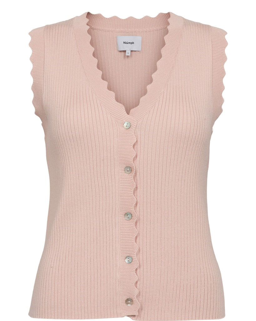 This beautiful feminine piece from Scandi brand NUMPH is fantastic with washed denim. A light ribbed waistcoat with scalloped edges around the arms and neckline. It has a V neck and buttons at the front with contrasting buttons.