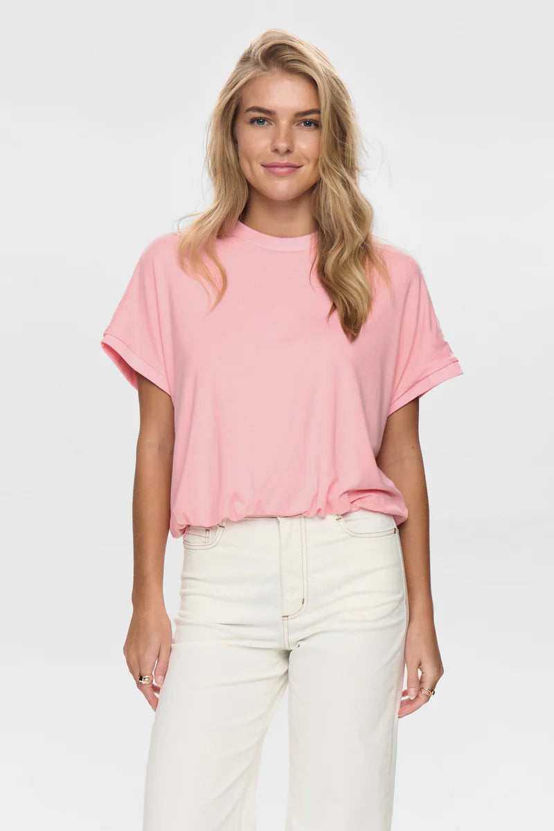 The NÜMPH Nuleah Boxy T-Shirt combines effortless comfort with contemporary style. Crafted from a luxurious viscose and elastane blend, this relaxed-fit tee features a generous boxy silhouette that flatters all shapes. The soft, breathable fabric moves with you throughout the day, while the elasticated hem ensures a polished finish. Perfect for layering or wearing solo, this versatile piece transitions seamlessly from casual weekends to relaxed workdays.