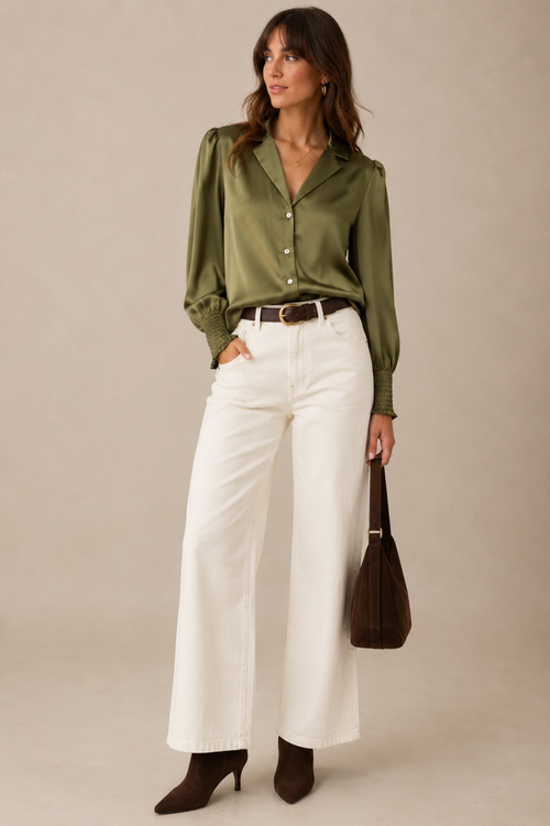 Elevate your wardrobe with this versatile long sleeve shirt from Numph. Crafted in a luxurious silky fabric, it features a refined small collar with button-down front, shirred cuffs for a polished finish, and thoughtful soft tuck pleating at the shoulders and back for subtle dimension and movement.