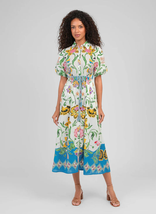 A true statement piece, this stunning shirt dress from An'ge combines effortless sophistication with vibrant colour. Designed with a classic button-through front and a flattering plaited belt, it creates a beautifully feminine silhouette while remaining comfortable and easy to wear.