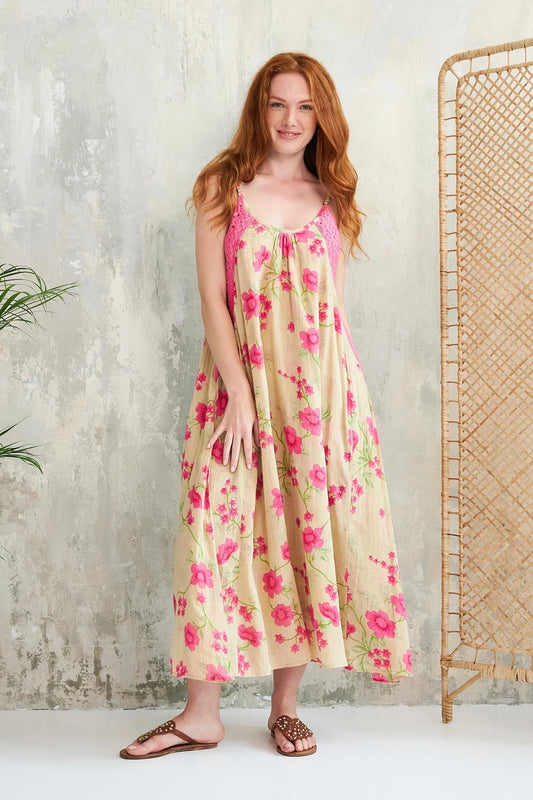 This stunning dress from French brand CHICO SOLEIL is the perfect dress for high summer or that long awaited hot holiday. A strappy dress in a cool cotton with shoe string straps that are adjustable. An oversized fit which is fully lined. There is a contrasting pink lacey trim on both sides of each strap. The fit is generous.