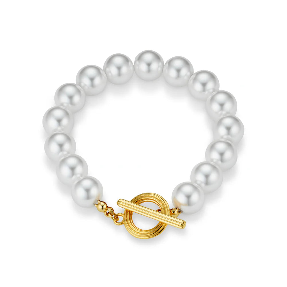 Update your wrist stack with this Statement Pearl T-Bar Bracelet from ORELIA, featuring a row of faux pearls and a gold t-bar fastening. Wear it solo or layer it up to create the ultimate wrist stack.