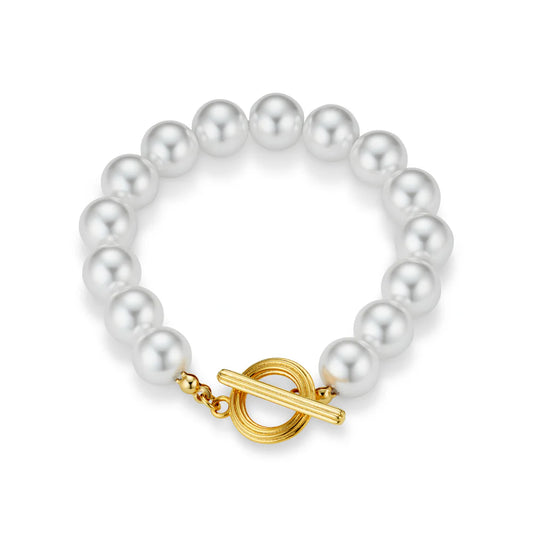 Update your wrist stack with this Statement Pearl T-Bar Bracelet from ORELIA, featuring a row of faux pearls and a gold t-bar fastening. Wear it solo or layer it up to create the ultimate wrist stack.