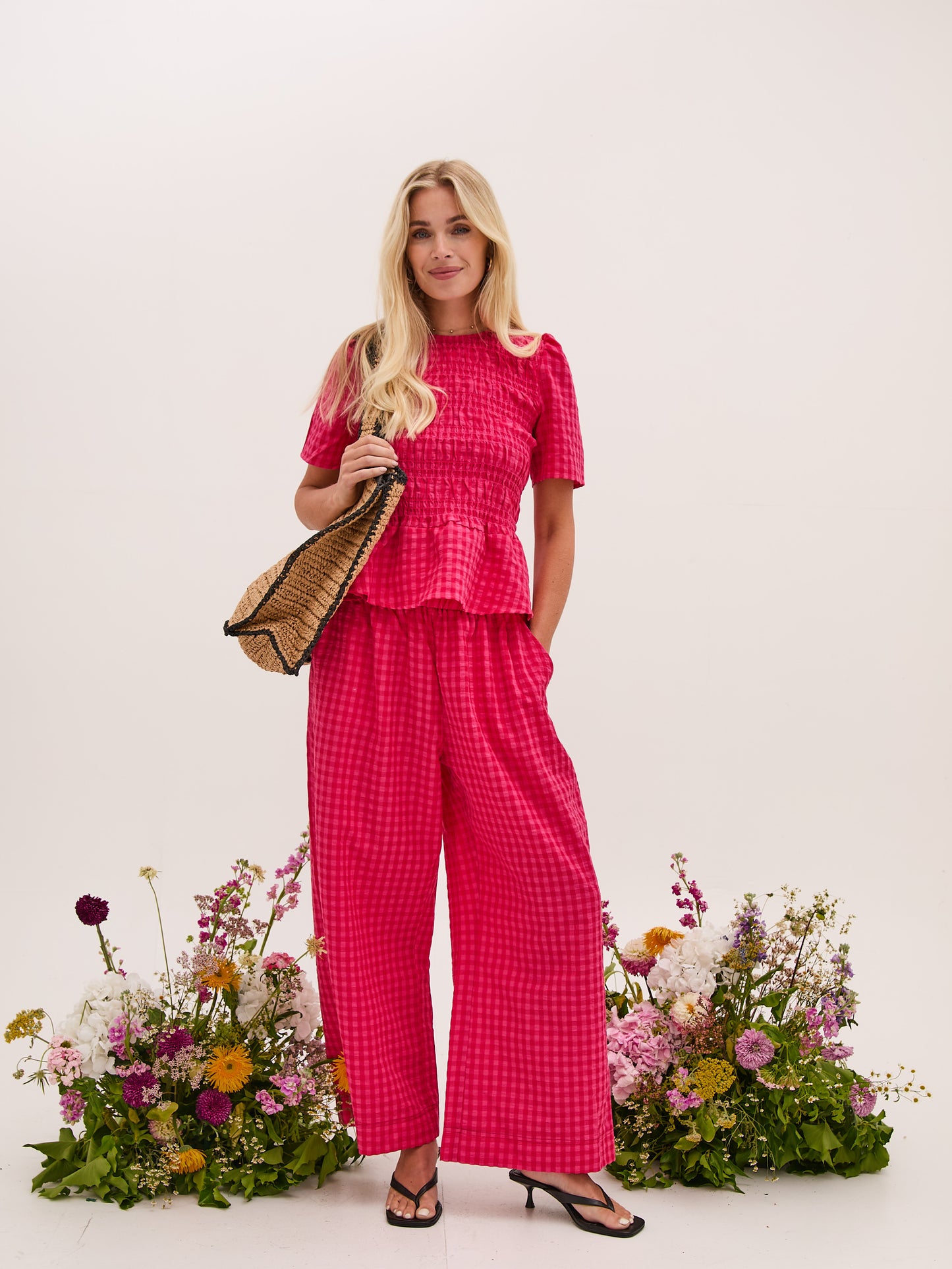 A vibrant pink gingham check pull on culotte from FIKA. These trousers have a deep elasticated waist and side pockets. The flattering wide leg is perfect for warmer weather. team with a T shirt or the matching blouse. The fit is true to size.