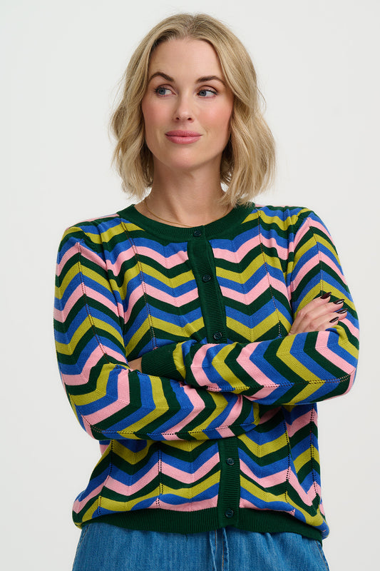 Add a pop of colour to your knitwear collection with the Rochelle Cardigan from SUGARHILL Brighton. Featuring a bold chevron stripe design in vibrant, feel-good shades, this cardigan is crafted from a soft, comfortable knit that’s perfect for layering. The classic round neckline and button-through front give it a timeless shape, while the striking pattern brings a playful twist to everyday outfits. Style it over a simple tee or dress to let the colours do the talking.
