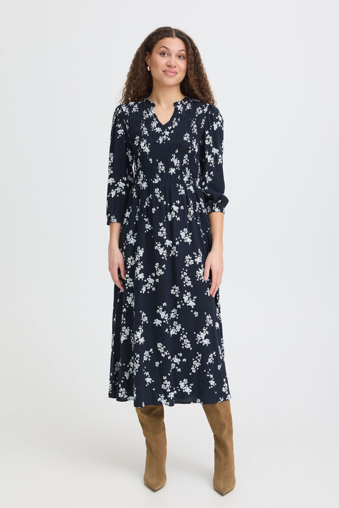 Midi dress with a gently fitted silhouette from FRANSA&nbsp; subtle gathered bodice and flowy skirt. Features a V-neckline, three-quarter sleeves, and softly textured finish.