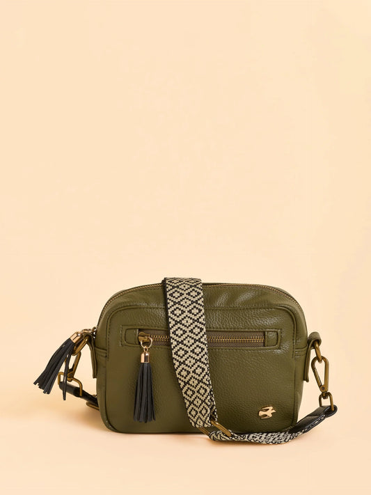 A sleek box cross body bag from BRAKEBURN designed for dinner dates and beyond. Made in deep green and featuring a detachable, adjustable ornate strap for versatile wear and two exterior pockets - one zip and one popper. Carry your essentials in style.