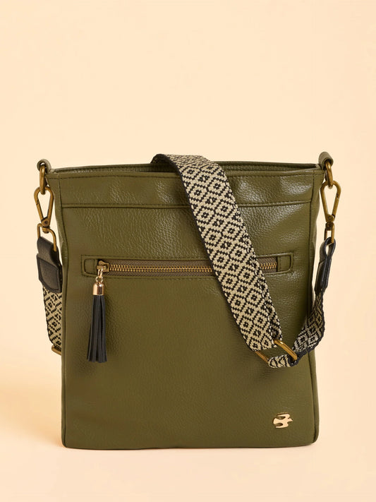 Your new everyday crossbody from BRAKEBURN, compact but ready for anything. Crafted with a wide front zip pocket and a hidden popper pocket on the reverse, it keeps your essentials close and organised. Finished with large tassel pulls and brass hardware, it’s the perfect hands-free companion for busy days on the move.