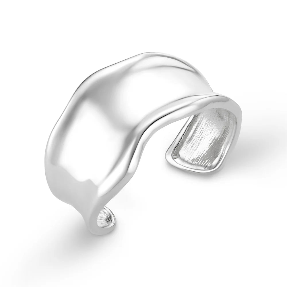 Add some drama to your outfit with this statement organic cuff in silver from ORELIA. Featuring a molten metal look this cuff is perfect for any outfit.