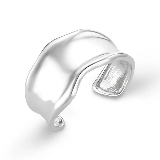 Add some drama to your outfit with this statement organic cuff in silver from ORELIA. Featuring a molten metal look this cuff is perfect for any outfit.