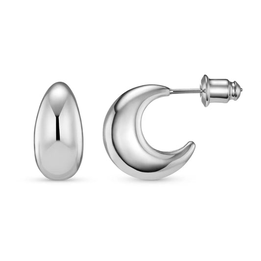 These classic silver hoops are a capsule piece. Introducing the Tapered Domed Hoop Earrings in Silver.

Featuring a chunky open circle silver hoop earring with a clean domed effect & stud fastening.