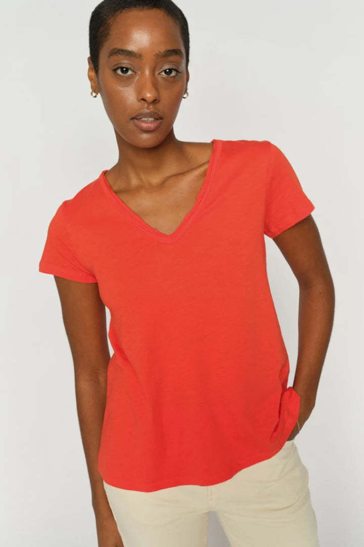 A timeless everyday essential from MOS MOSH, this soft V-neck tee is designed in a fitted silhouette that flatters the figure beautifully. The smooth texture and classic cut make it perfect for layering or wearing solo. Pair it with jeans for a casual look or tuck it into tailored pants for effortless sophistication. The fit is true to size.