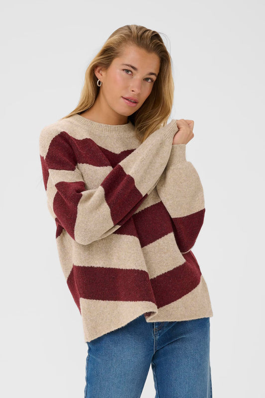 This knitted pullover from KAFFE features a relaxed fit, long sleeves, and a timeless design, making it a versatile addition to any wardrobe. The pullover is crafted from soft materials and is easy to pair with everything from jeans to skirts. The colour of the season too.