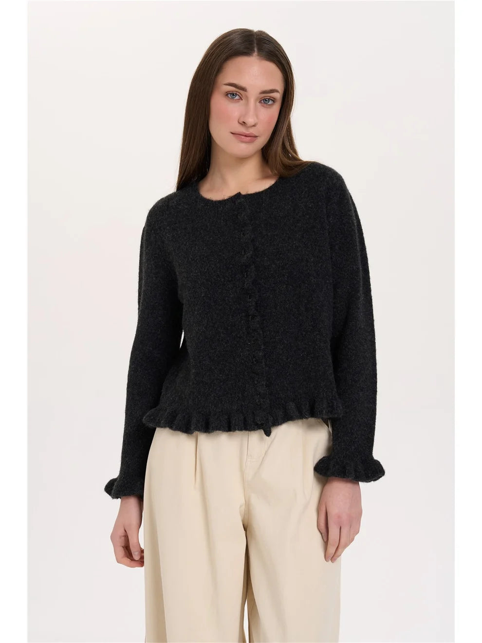 The Vivian Cardigan from 24 COLOURS is a lovely feminine piece. The cardigan has delicate button fastening finished with a frilled cuff. There is a frill on the placket and also the hem. It's a gentle black rather than solid. The fit is true to size.