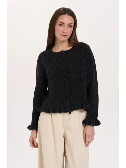 The Vivian Cardigan from 24 COLOURS is a lovely feminine piece. The cardigan has delicate button fastening finished with a frilled cuff. There is a frill on the placket and also the hem. It's a gentle black rather than solid. The fit is true to size.