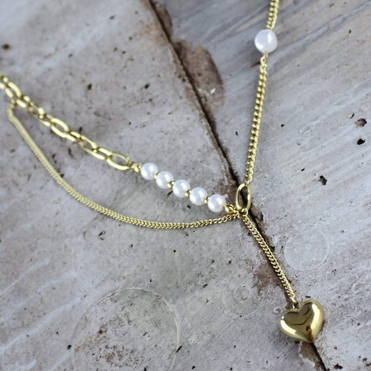 This stunning waterproof necklace features a delicate and timeless heart design, crafted from luxurious 18 carat gold. The perfect gift for someone special or a delightful treat for yourself, this piece can be worn every day, adding a touch of elegance to any outfit. Whether you're dressing up for a night out or keeping it casual, this waterproof necklace is versatile and durable, designed to withstand the test of time and the elements. The heart pendant is carefully crafted to catch the light and shimmer 